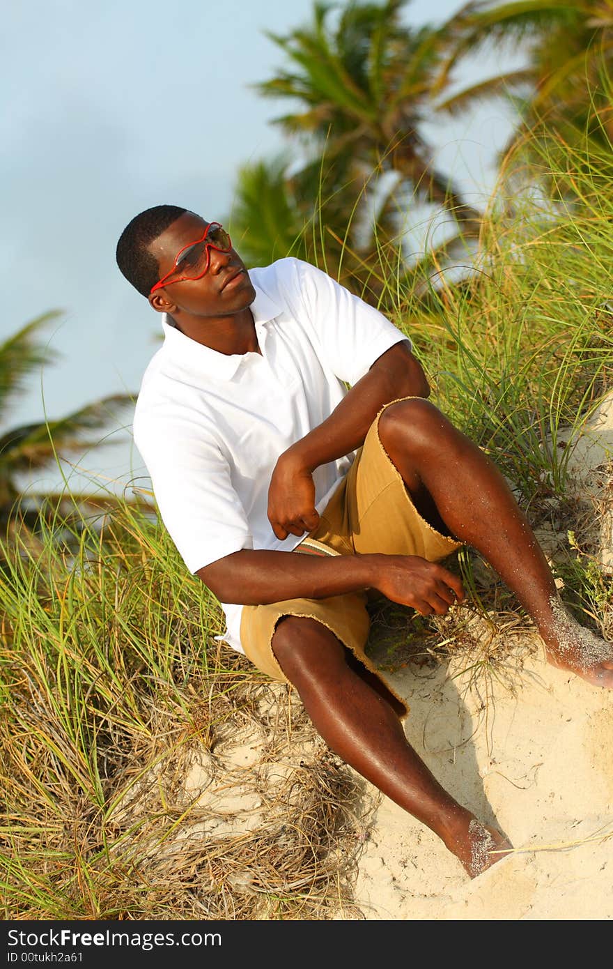 Stylish young black man with red sunglasses. Stylish young black man with red sunglasses