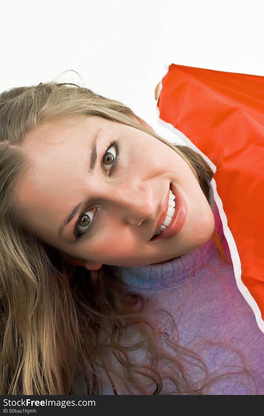 Happy young lady under a red umbrella