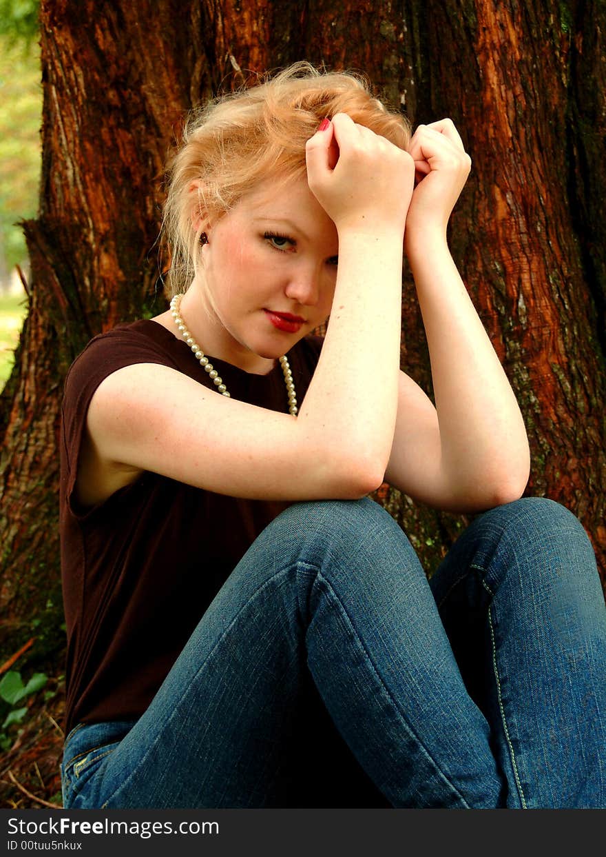 Young Woman By Cedar Tree