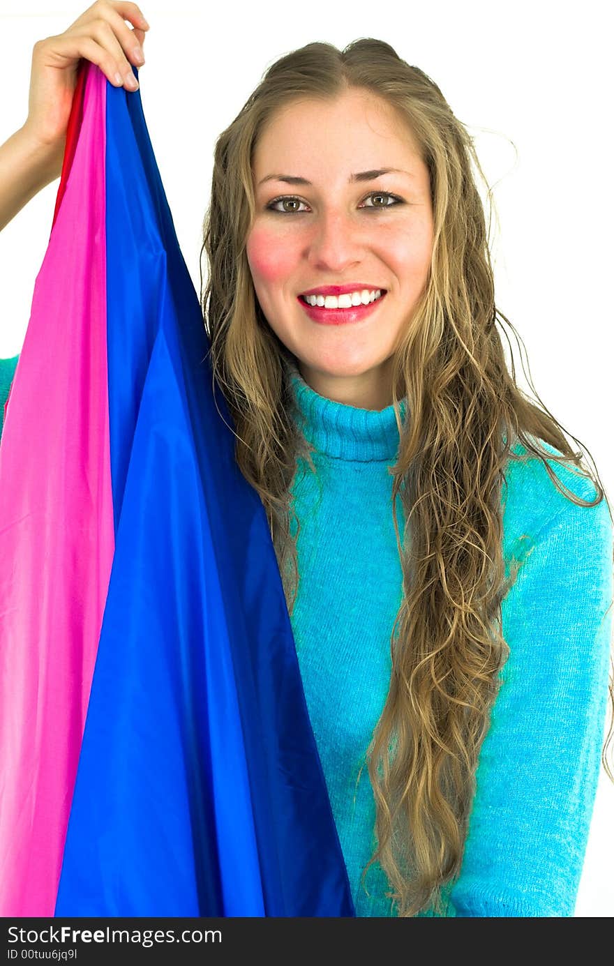 Smiling young woman with a blue and purple flag