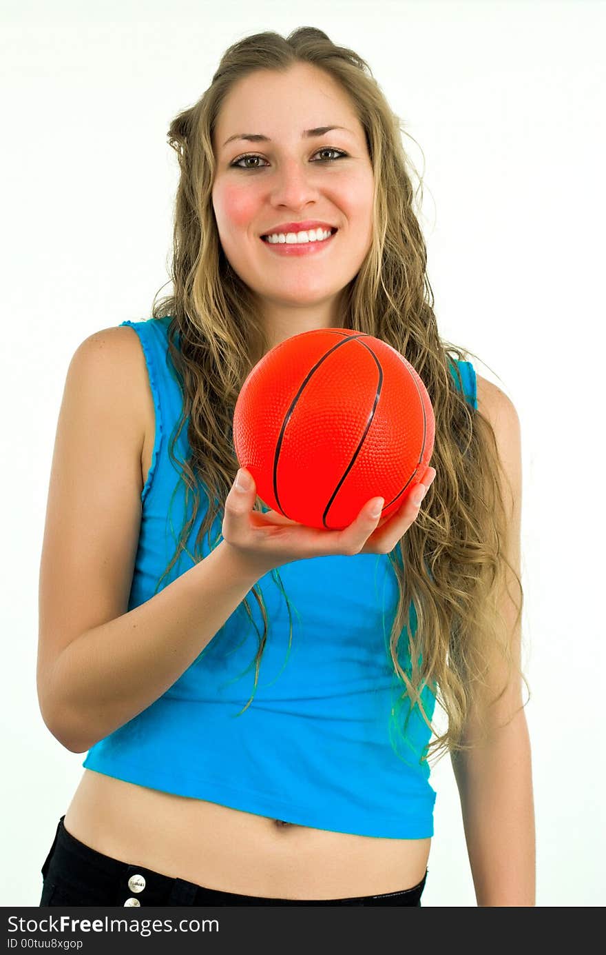 Smiling lady in blue with a small red ball in hands