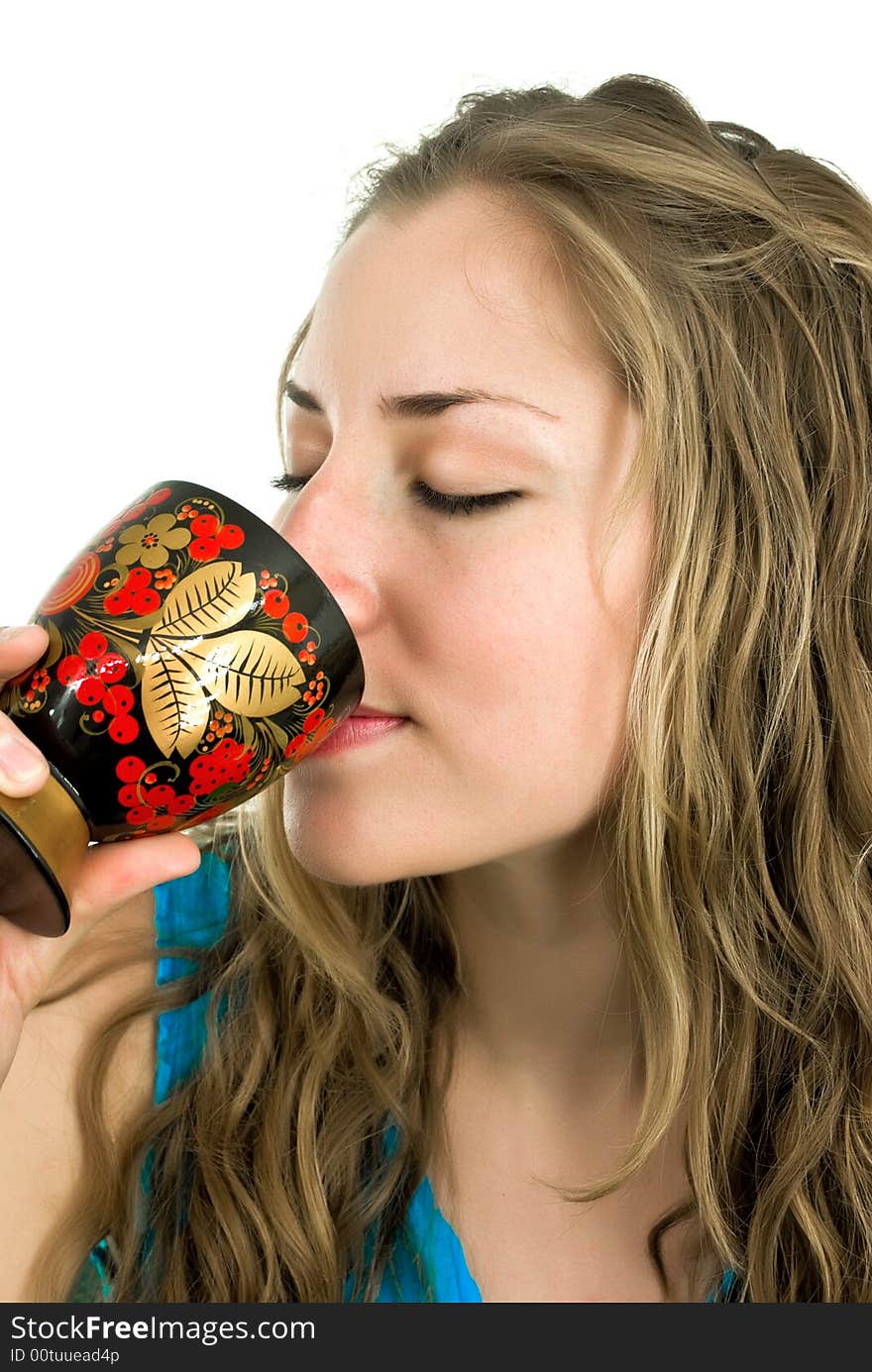 Young woman sipping from a goblet