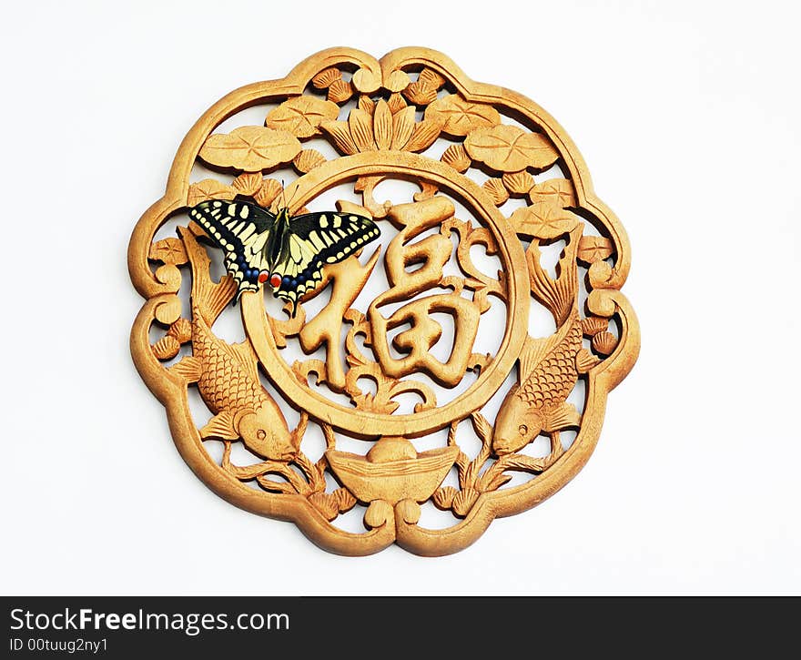 A butterfly stays on benediction ornament ,in the white background