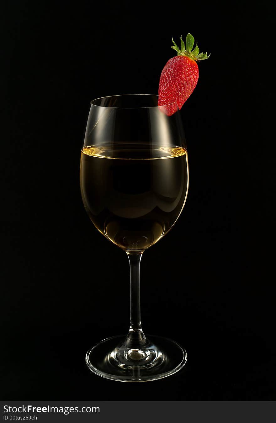 Strawberry in the glass of white wine. Strawberry in the glass of white wine