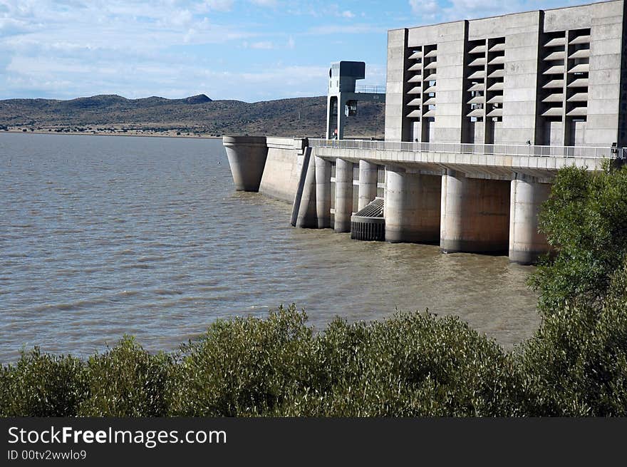 A large concrete dam wall, photographed in South Africa.