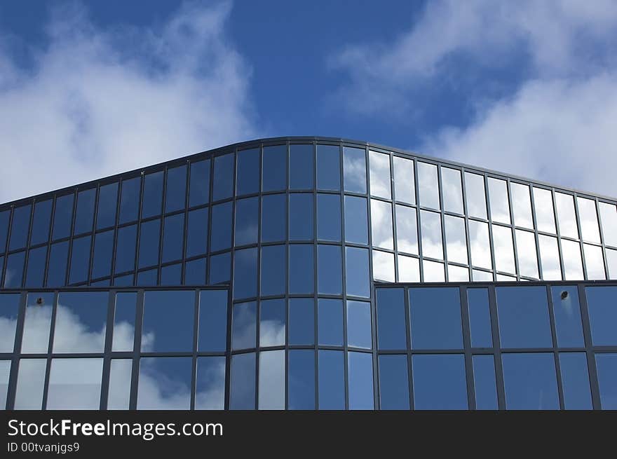 Detail of an office building facade with blue windows