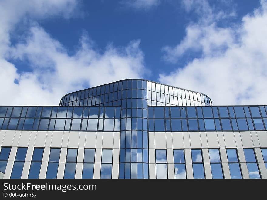 Detail of an office building facade with blue windows