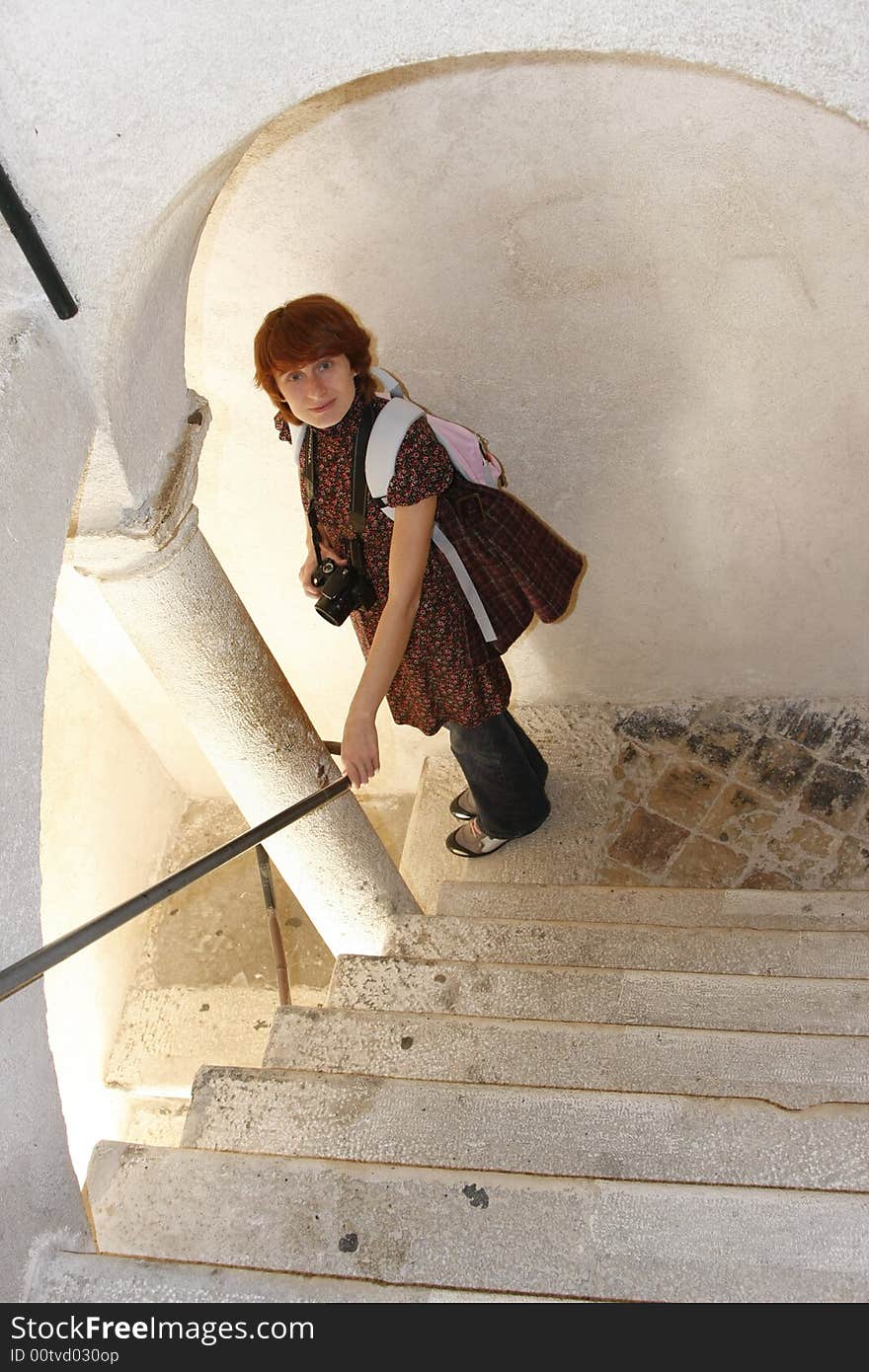 Beautiful girl with a camera in a fort of Dubrovnik (Croatia)