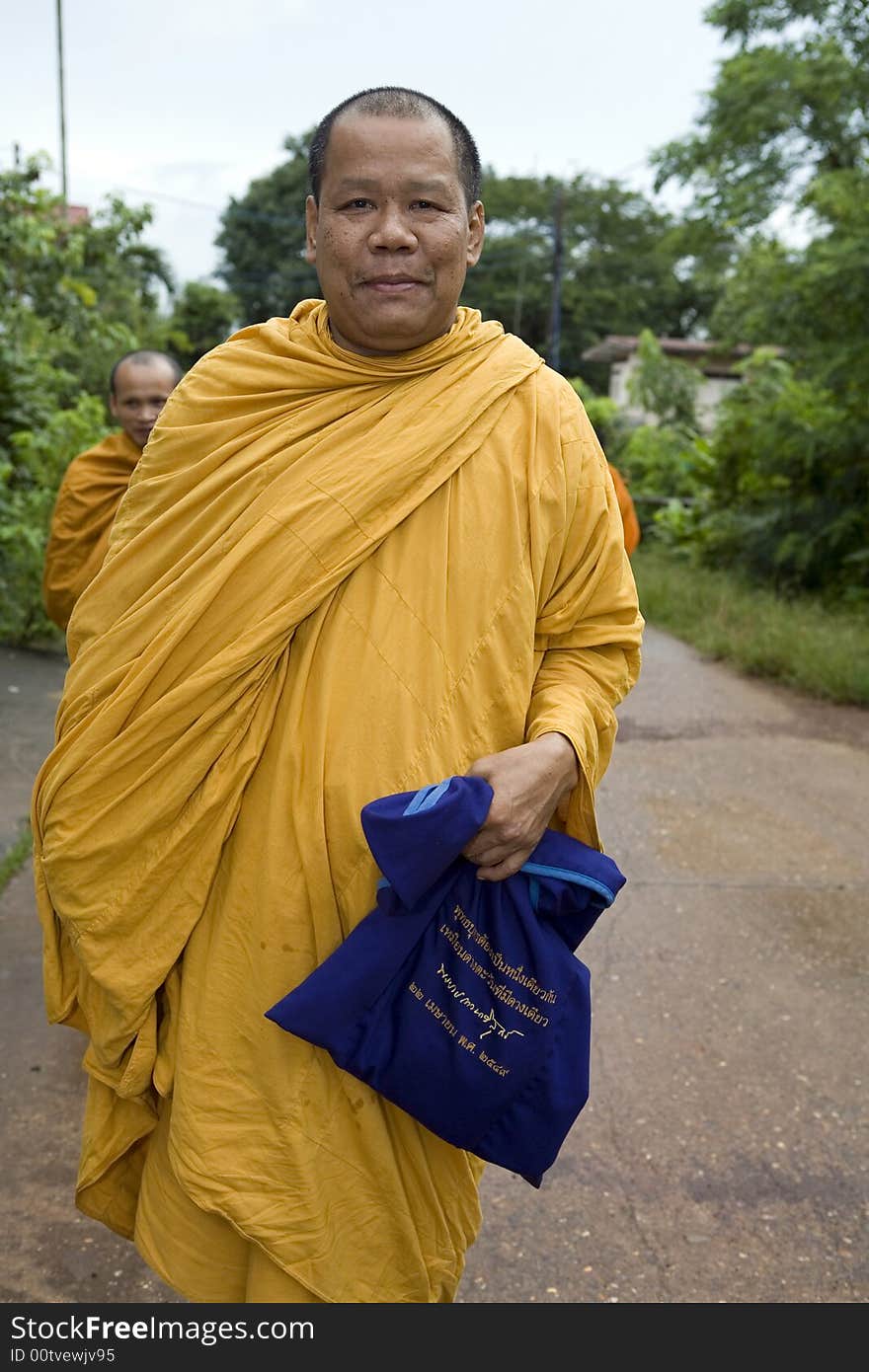 Buddhist monk from Thailand in traditional orange garb