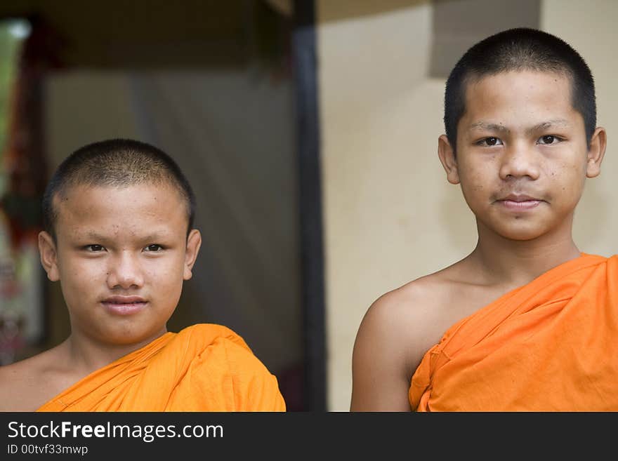 Buddhist monk from Thailand in traditional orange garb