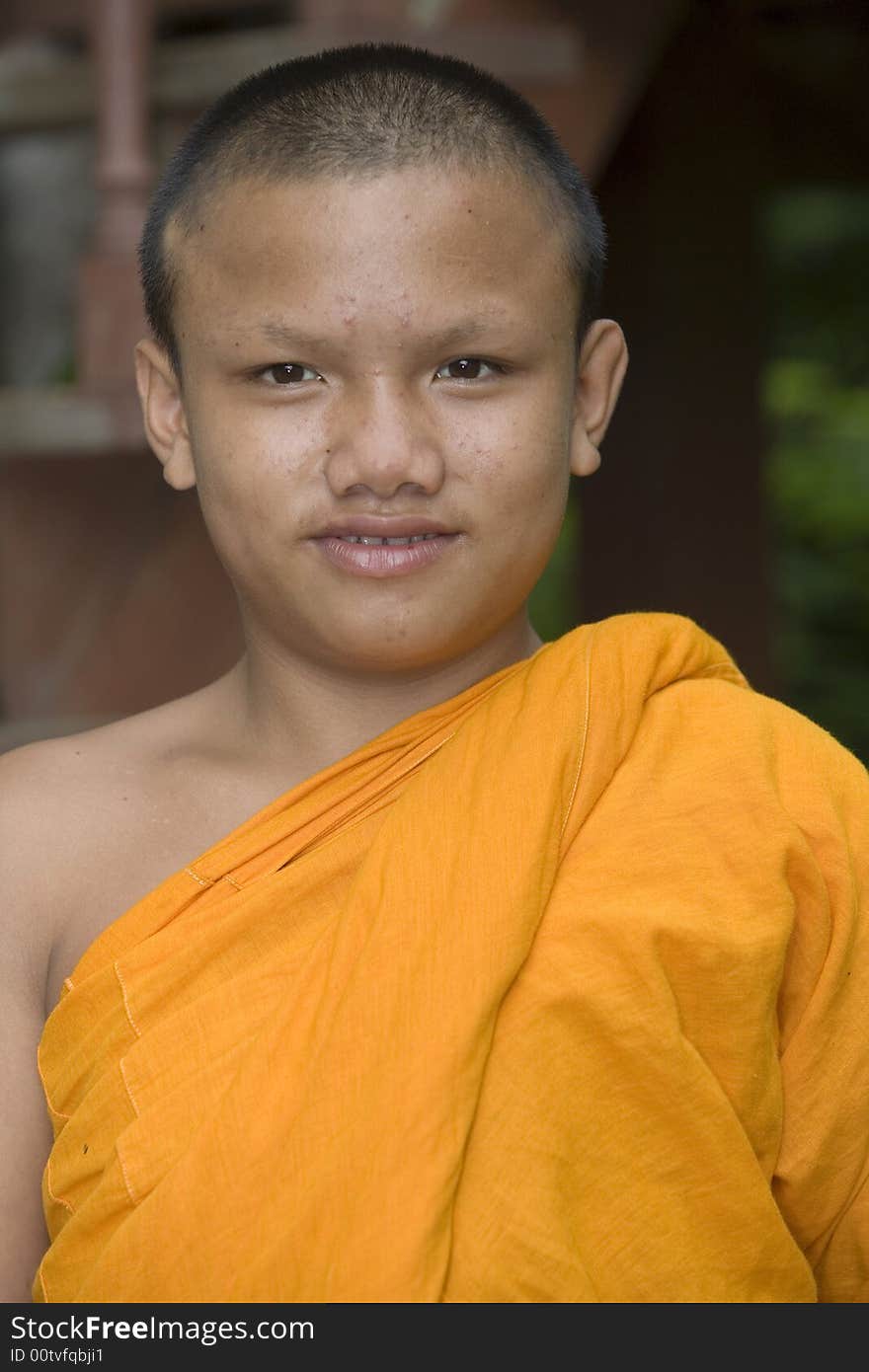 Buddhist monk from Thailand in traditional orange garb