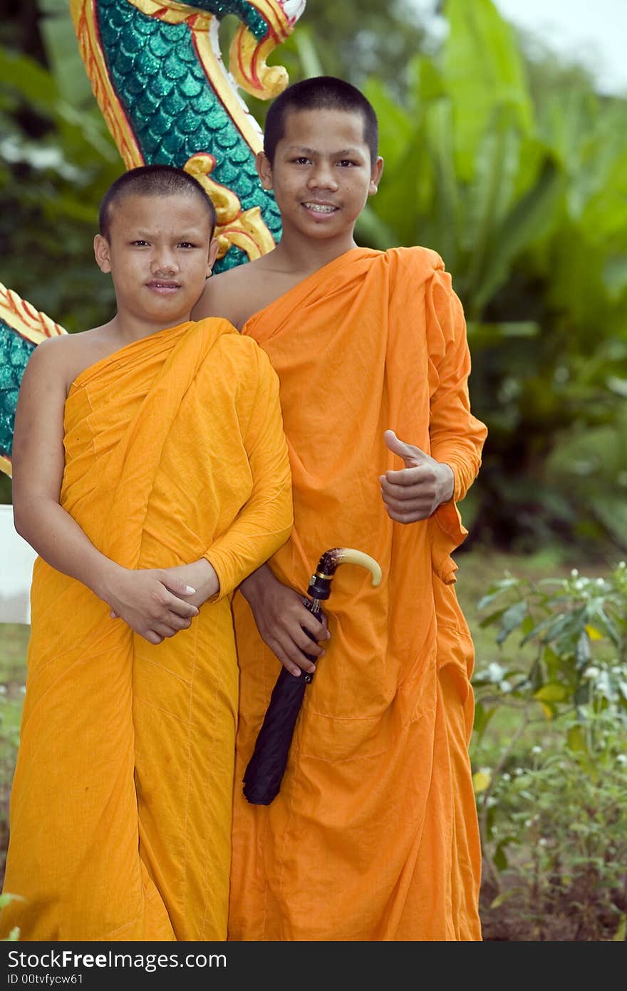 Buddhist monk from Thailand in traditional orange garb