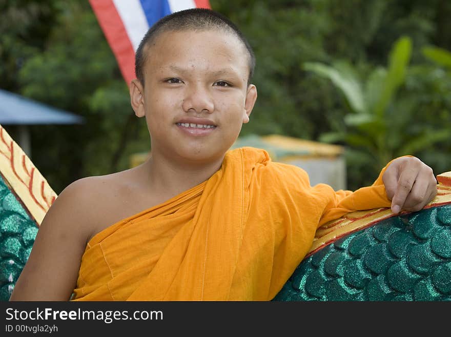 Buddhist monk from Thailand in traditional orange garb