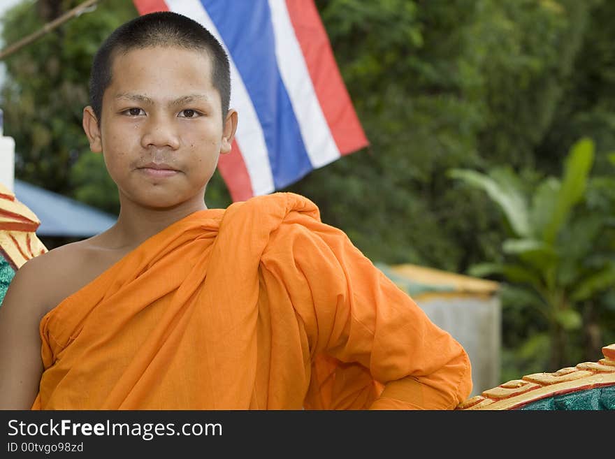 Buddhist monk from Thailand in traditional orange garb