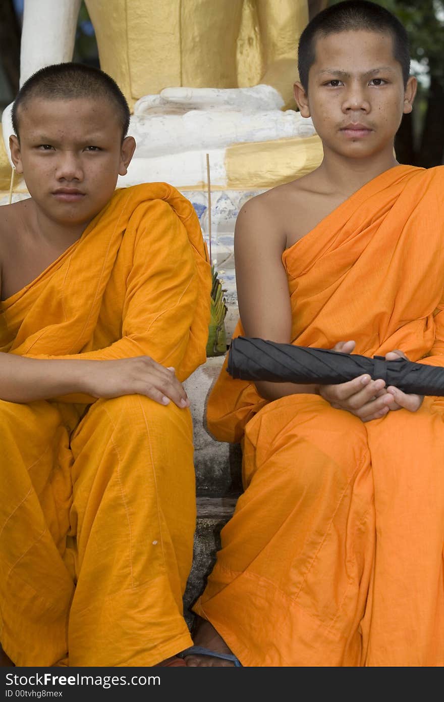 Buddhist monk from Thailand in traditional orange garb