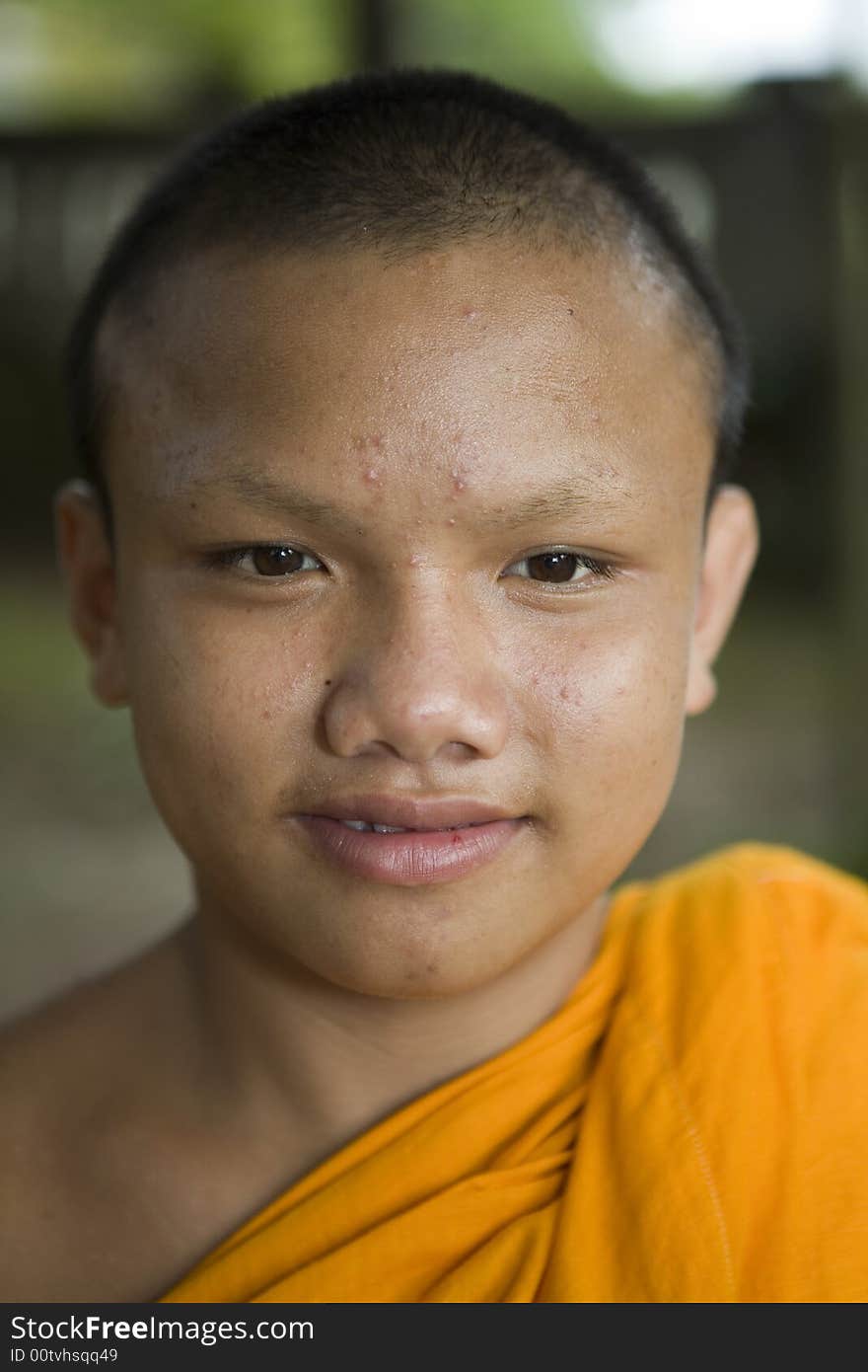 Buddhist monk from Thailand in traditional orange garb