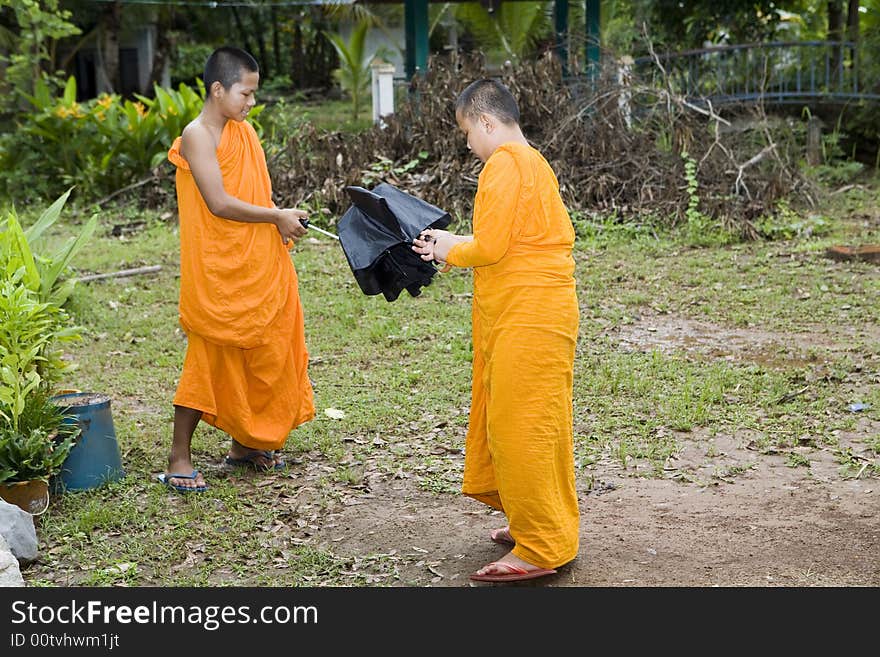 Buddhist monk from Thailand in traditional orange garb