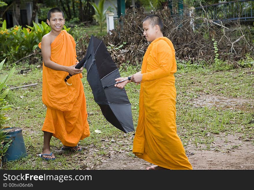 Buddhist monk from Thailand in traditional orange garb