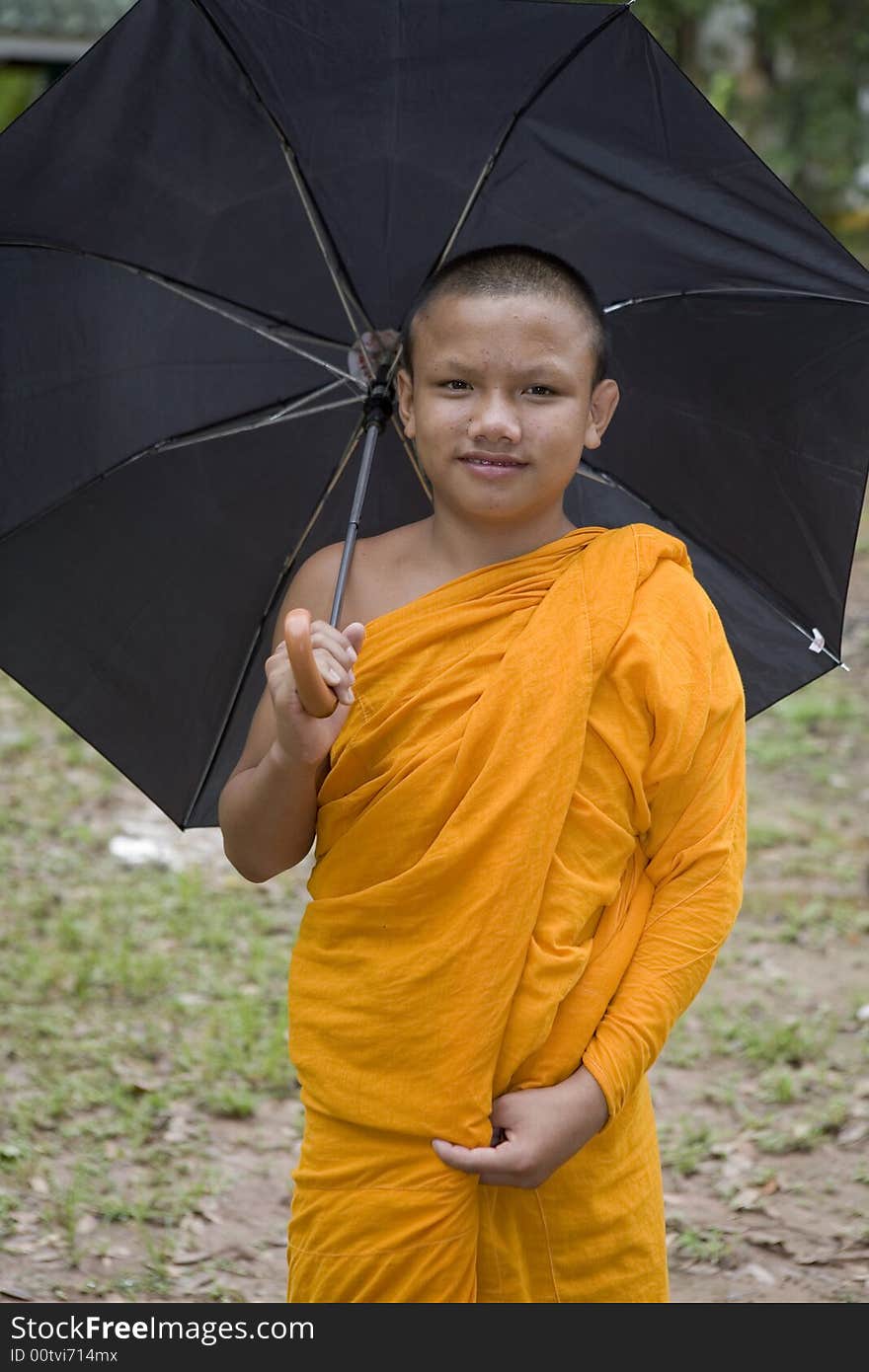 Buddhist monk from Thailand in traditional orange garb