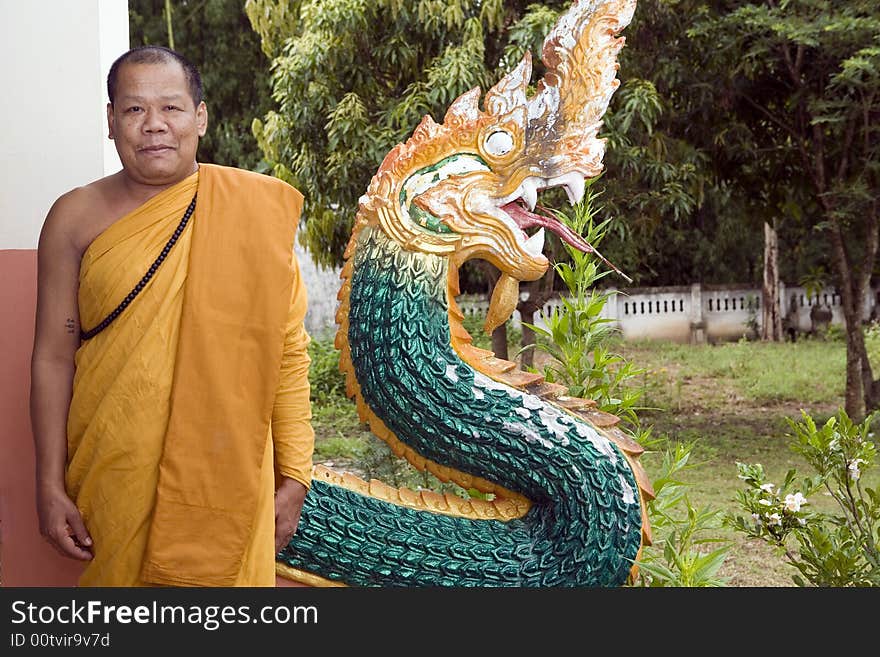 Buddhist monk from Thailand in traditional orange garb