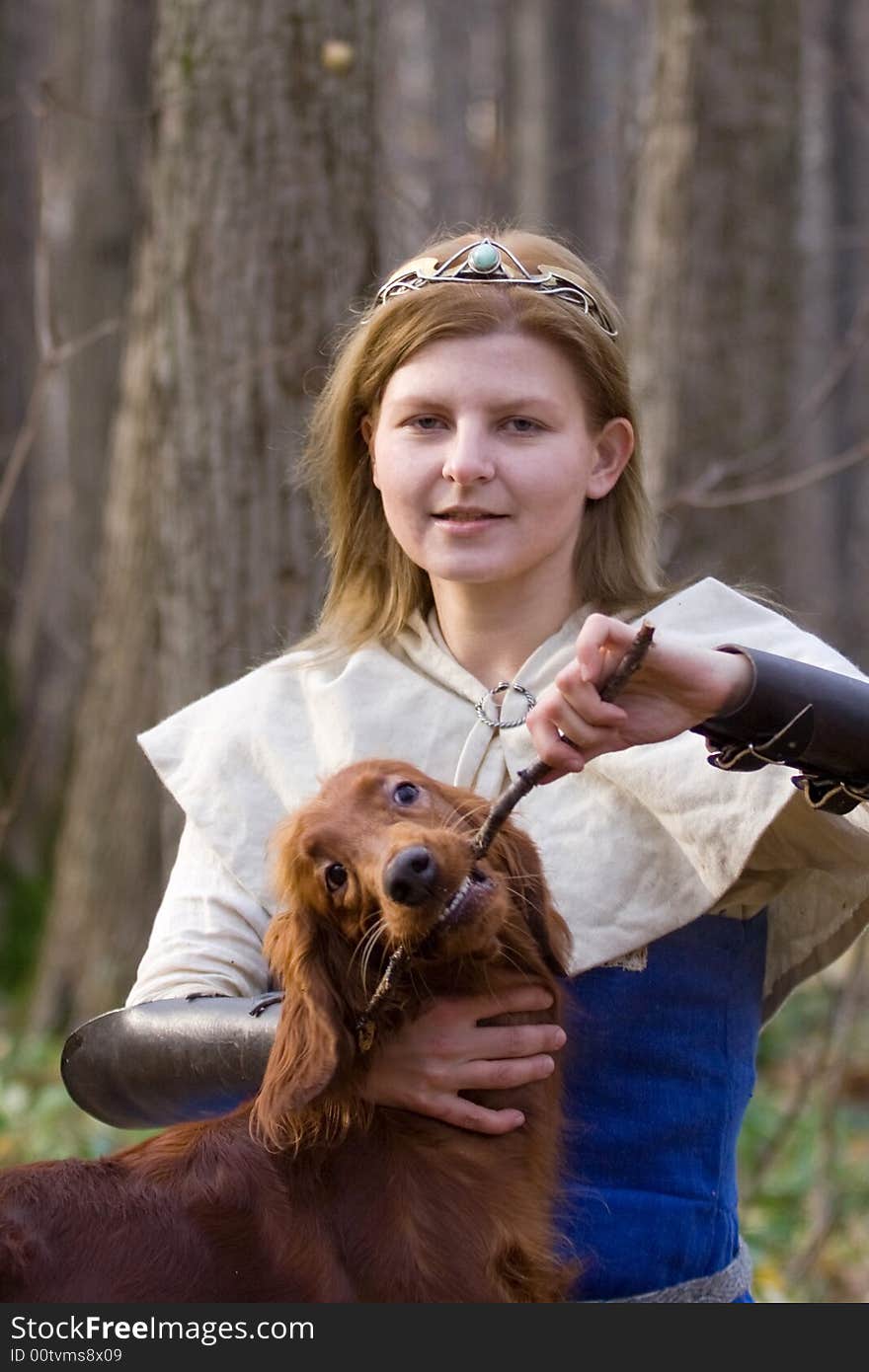 Portrait of the girl and irish setter in autumn forest. Portrait of the girl and irish setter in autumn forest.