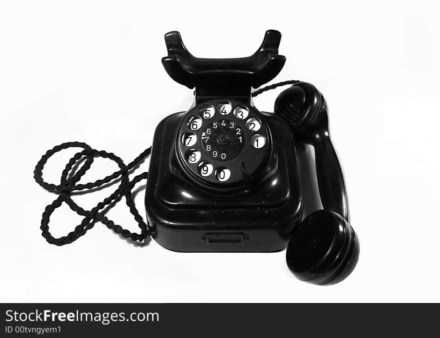 Old classic black telephone on white background. Old classic black telephone on white background