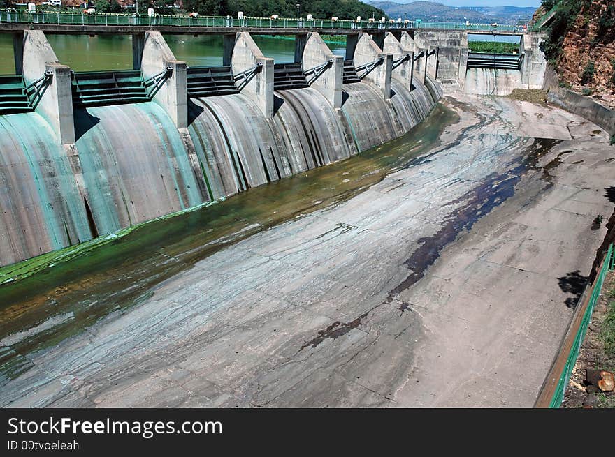 A large concrete dam wall, photographed in South Africa.