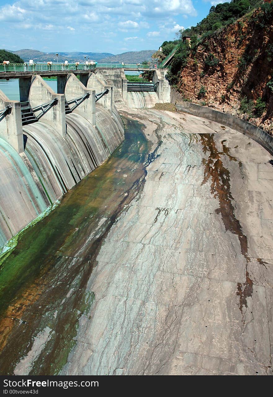 A large concrete dam wall, photographed in South Africa.