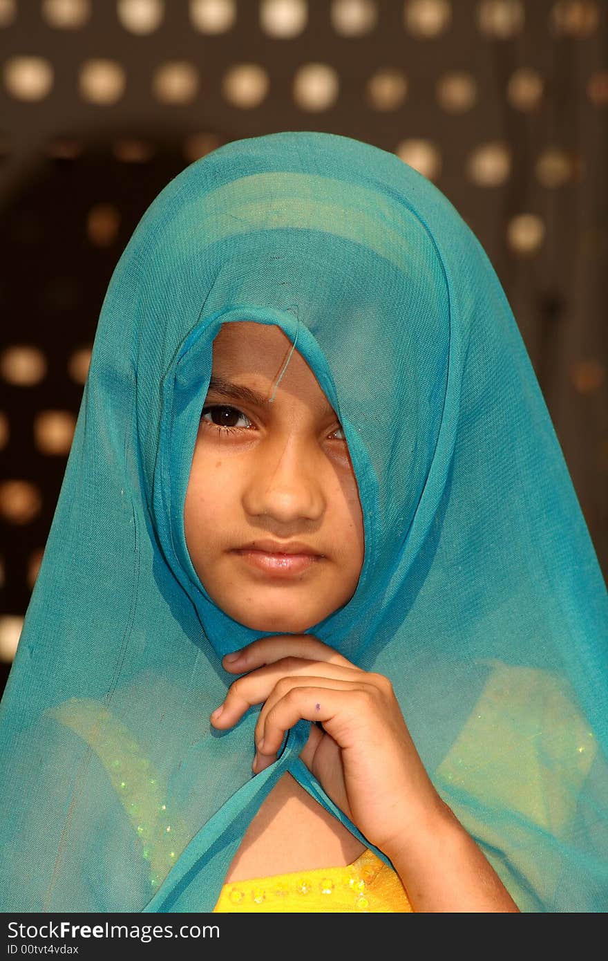 A beautiful small girl in a traditional dress. A beautiful small girl in a traditional dress.