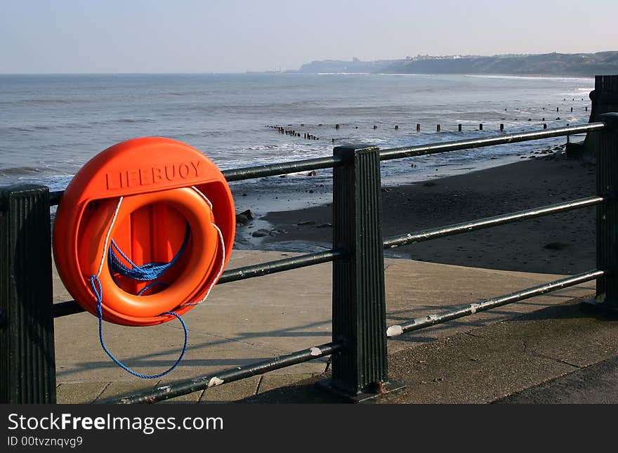 Lifebelt with Whitby in background. Lifebelt with Whitby in background