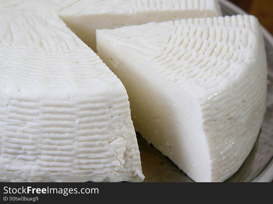 Salty hard cheese, Greek style, on a table