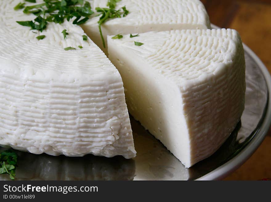 Salty hard cheese, Greek style, on a table