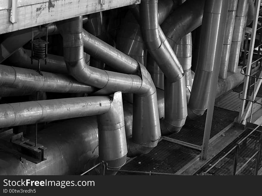 An assortment of different size and shaped pipes at a power plant