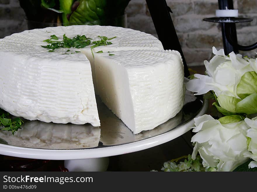 Salty hard cheese, Greek style, on a table