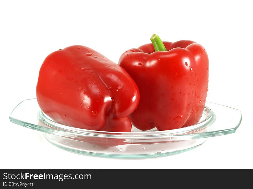 Red pepper and leaves of salad isolated on a white background