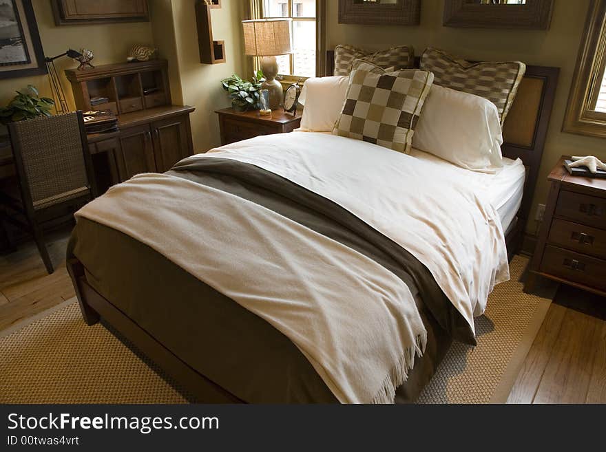 Comfortable bedroom in a luxury home with stylish decor. Comfortable bedroom in a luxury home with stylish decor.