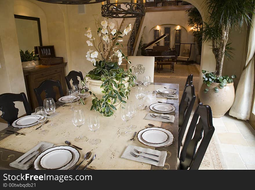 Festive dining table with luxurious dinnerware and decor. Festive dining table with luxurious dinnerware and decor.