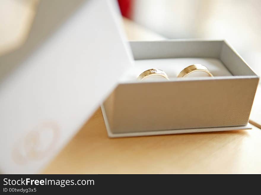 Married ring in a box on a table with blur background