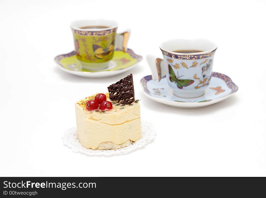 Sweet cream dessert with cup of coffee isolated on white background. Sweet cream dessert with cup of coffee isolated on white background