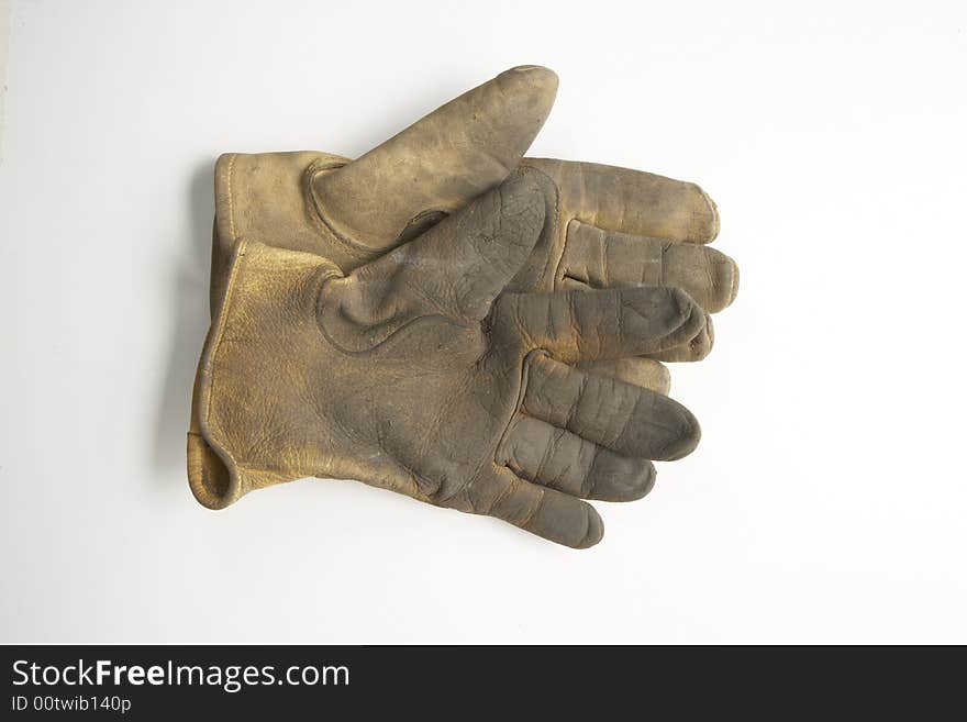 Image of a pair of right gloves without the left glove.  These are calf skin work gloves used for gardening and other outside labor.  It is viewed from overhead. Image of a pair of right gloves without the left glove.  These are calf skin work gloves used for gardening and other outside labor.  It is viewed from overhead.