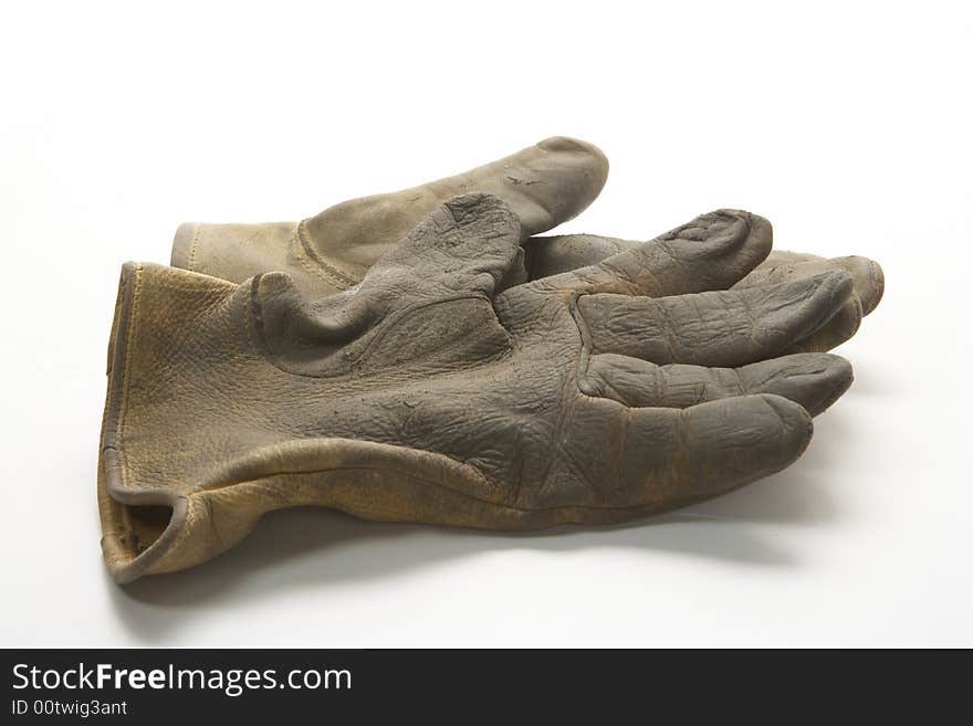 Image of two right gloves or a pair of gloves.  These gloves are  calf skin work gloves used for gardening and other outside labor.  It is viewed from the side. Image of two right gloves or a pair of gloves.  These gloves are  calf skin work gloves used for gardening and other outside labor.  It is viewed from the side.