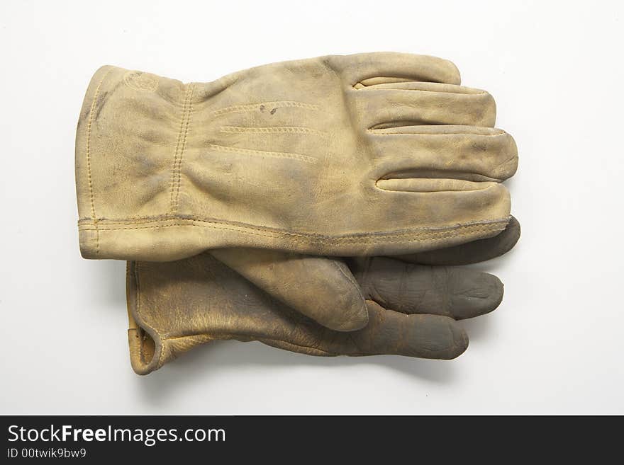 Image of a pair of right gloves without the left glove.  These are calf skin work gloves used for gardening and other outside labor.  Ine glove is on top of the other palm facing each other.  They are viewed from overhead. Image of a pair of right gloves without the left glove.  These are calf skin work gloves used for gardening and other outside labor.  Ine glove is on top of the other palm facing each other.  They are viewed from overhead.