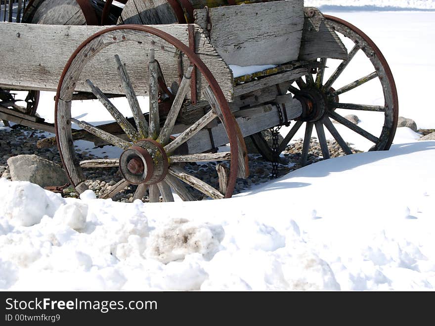 Old wagon buried in the deep snow. Old wagon buried in the deep snow.