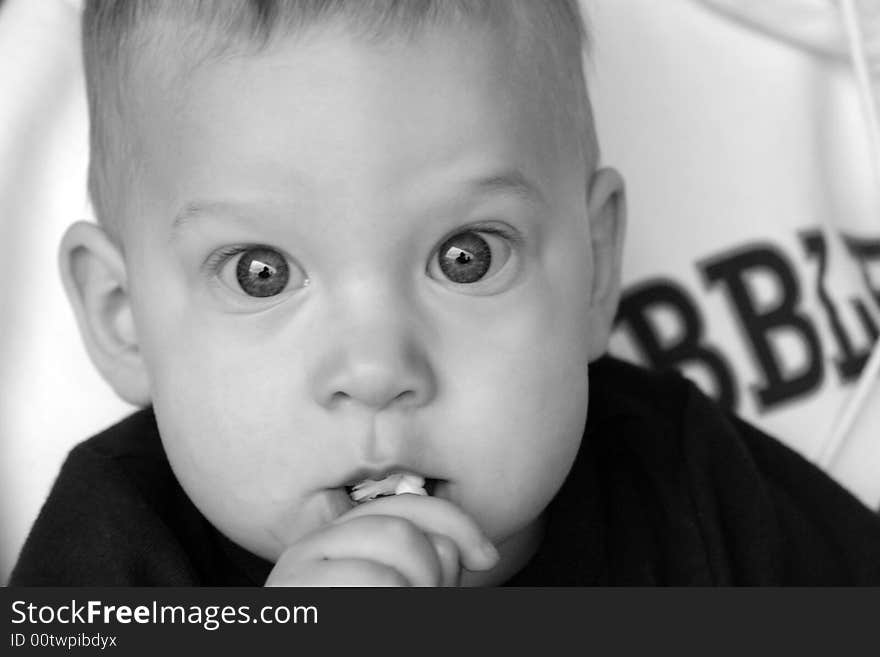 8 month old baby boy with beautiful big eyes. 8 month old baby boy with beautiful big eyes.