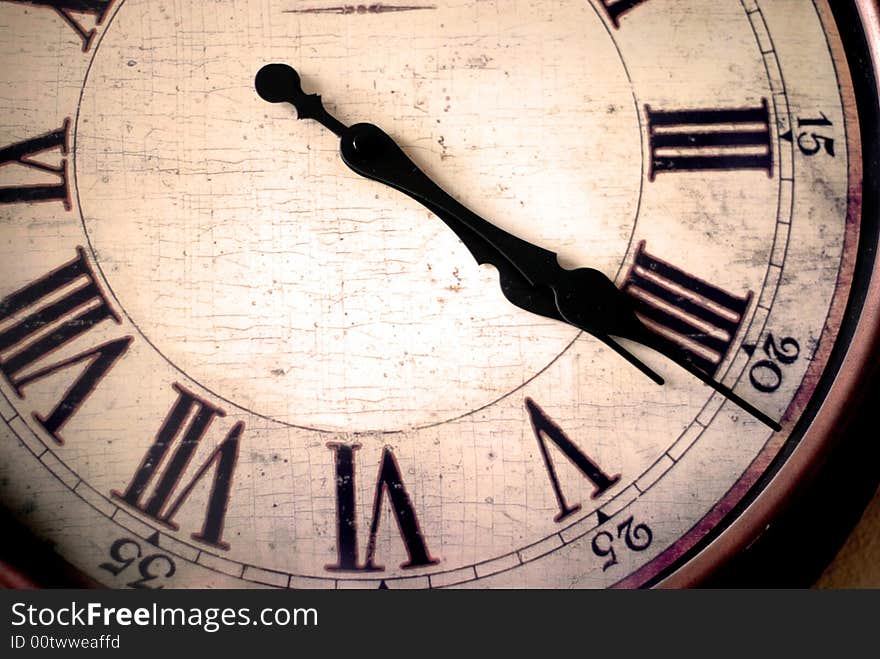 Detail of clock face with numbers and hands showing time. Detail of clock face with numbers and hands showing time