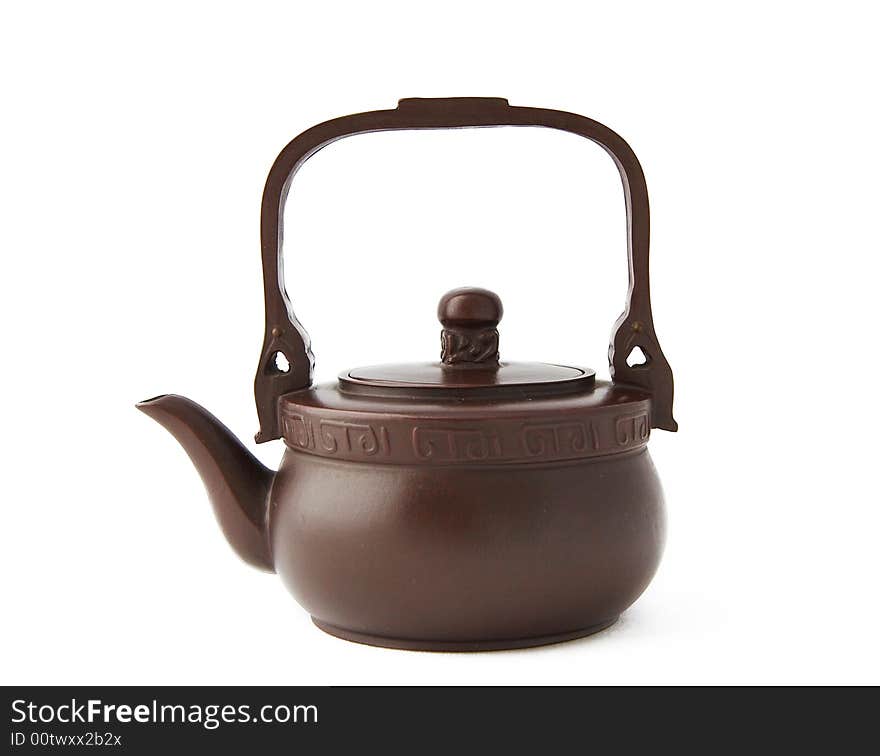 Clay teapot,also called zisha teapot in China,also it is a artwork. isolated on white background. Clay teapot,also called zisha teapot in China,also it is a artwork. isolated on white background.