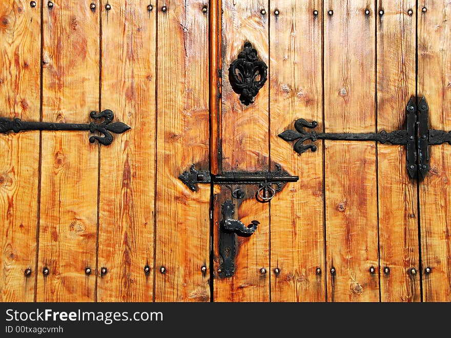 Wooden door with metallic patterns. Wooden door with metallic patterns