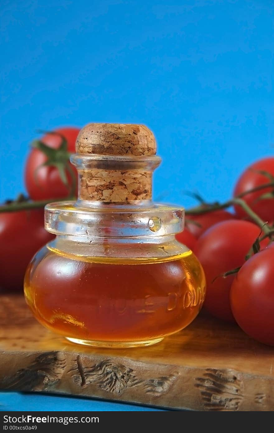 Oil olive and tomatos in bunch