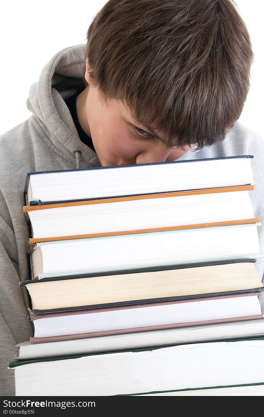 The Young Student With A Pile Of Books Isolated