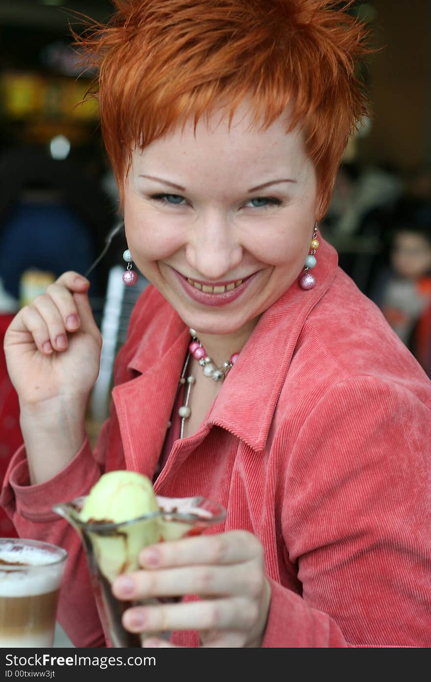 Woman Eating Ice-cream In Cafe